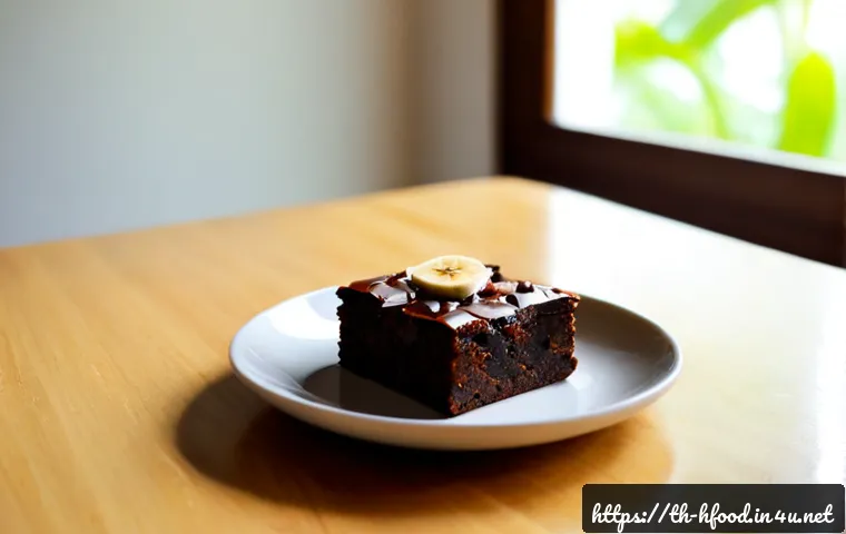 Home 17 다이어트 디저트 단백질 브라우니 레시피 - Photorealistic healthy protein brownie squares on a small ceramic plate, rich dark chocolate texture...